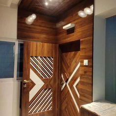 an open wooden door with geometric designs on it