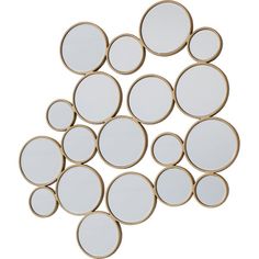 a bunch of mirrors sitting on top of a white floor next to each other in the shape of circles