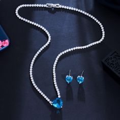 CWW Women's Fashion Elegant Stylish Light Blue Heart Luxury Cubic Zirconia Jewelry Sets - Divine Inspiration Styles Elegant Blue Heart Necklace For Valentine's Day, Luxury Blue Women's Jewelry Sets, Blue Heart-shaped Necklace For Formal Occasions, Elegant Light Blue Crystal Necklace For Gift, Elegant Blue Crystal Rhinestone Necklace, Heart Jewelry Set, Engagement Parties, Earrings And Necklace, Fashion Jewelry Sets