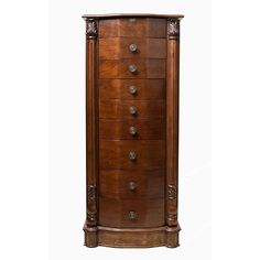 a tall wooden cabinet with many drawers