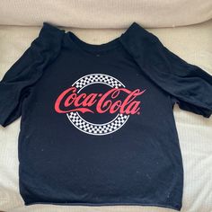 Nwot L/S Cute Coca-Cola T Shirt Size Is Xs Band Merch Crew Neck Top With Slogan, Black Band Merch Tops With Slogan, Black Slogan Band Merch Tops, Black Y2k Crew Neck Shirt, Black Y2k Shirt With Crew Neck, Black Y2k Style Crew Neck Shirt, Black Y2k Shirt With Letter Print, Black Y2k Tops With Logo Print, Y2k Black Tops With Logo Print