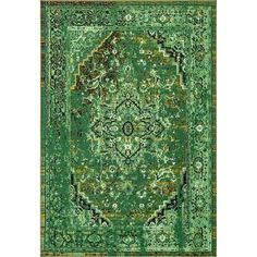 a green rug with an ornate design