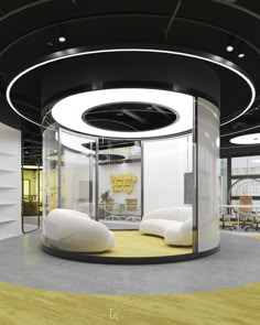 an office with round glass walls and yellow carpeted flooring is pictured in this image