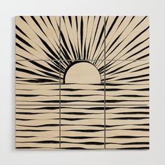 an art piece with black and white lines in the shape of a sun over water