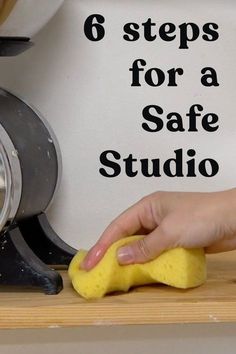 a person using a sponge to clean a kitchen counter top with the words 6 steps for a safe studio on it