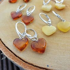 Welcome to handmade Baltic Amber jewelry shop. This Item is made of genuine, natural Amber. This item will make You look simple but gorgeous. Small Amber heart shape earrings. Natural Baltic Amber. Handmade heart earring. Small lever back earring made of real gemstone.   Weight: ~ 1-2  gr  Length: ~  3 cm Our handmade jewelry is made with passion and love. If you have any problems with your order please contact us. Please note that colors can vary from originals depending on computer monitor's settings. Due to amber is being unique and natural gemstone, each item may be slightly different in shades or shapes. Items may have natural imperfections like lines and spots, specks, coloration and inclusions, layers and lines .  All amber is fossilized tree resin and it is extremely light gemstone Nickel-free Heart Earrings For Her, Round Earrings With Heart Charm As A Gift, Heart-shaped Jewelry With Ear Wire For Gifts, Handmade Heart-shaped Earrings For Her, Handmade Heart-shaped Earrings, Handmade Heart-shaped Earrings For Gifts, Handmade Heart Cut Earrings As Gift, Handmade Double Heart Earrings For Gift, Handmade Heart-shaped Earrings As A Gift For Her