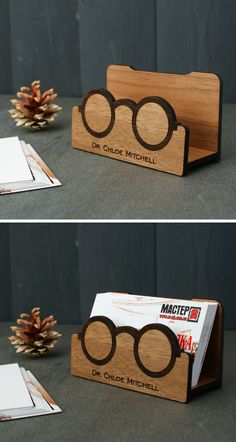 two pictures of wooden business cards with glasses on them and pine cones in the background