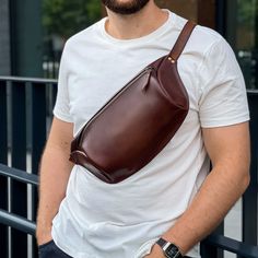 Our leather belt bag, this thing is for those who do not like extra things in the pocket, perfect for (phone, cigarettes, keys, airpods, money clip, etc). We designed this model Fanny Pack specifically for comfortable everyday wear. This model is multifunctional, it is convenient to wear both on the belt and on the chest. On the bag there is an adjustable belt with natural fabric, the main advantages are strength, convenience, does not leave marks on clothes. MAIN CHARACTERISTICS: - This fanny pack is handmade; - There is no lining inside; - Material: genuine leather; - Please note that this is a handmade item. Due to raw materials each leather bag is unique. Therefore there might be slight differences in colour and texture. Also be aware that colour of the product may vary depending on a Men Shoulder Bag, Waist Bag Leather, Full Grain Leather Bag, Fanny Bag, Bag Belt, Leather Belt Bag, Natural Fabric, Mens Leather Bag, Hip Bag