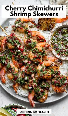 shrimp skewers with white rice and garnished with herbs on a plate