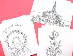 three cards with drawings on them sitting next to each other in front of a pink background