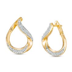 Choose these sparkling diamond earrings to amp up your wardrobe. A great addition to any attire, each 10K gold earring features two ribbons of diamonds along the twisting teardrop-shaped design that wraps around the earlobe for a striking look. Radiant with 1/3 ct. t.w. of diamonds and a bright polished shine, these flat-front earrings secure with hinged backs. Indian Diamond Jewellery, Twist Earrings, Y2k Jewelry, Fancy Rings, Diamond Jewelry Necklace, Gold Ring Designs, Peoples Jewellers, Sparkling Diamond, Local Jewelry