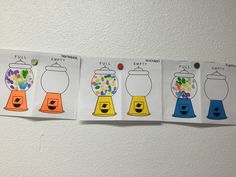 four cards with different types of gummy bears in them on a white wall,