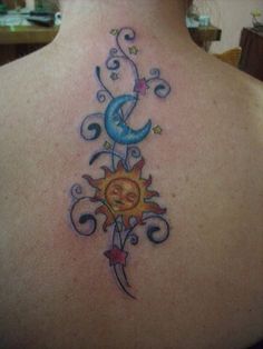 a sun and moon tattoo on the back of a woman's upper back shoulder