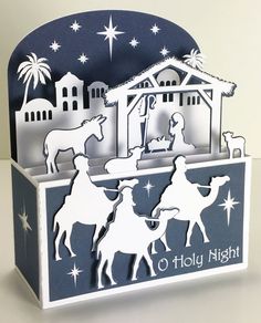 a nativity scene with three wise men riding on horses