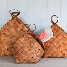 three woven baskets sitting next to each other