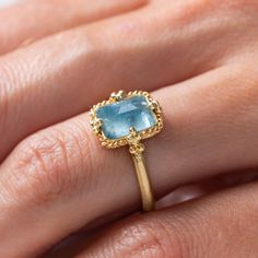 The misty blue depths in this petite, rectangular Aquamarine reflect a perfect summer sky. We set this soothing gemstone in a meticulously handmade gold bezel accented with braided gold and held fast with granulated prongs.Ready to ship in size 7. Please allow 1-2 weeks for any other size. Technical Details Metal: 18k yellow goldAquamarine: 2.28 cts. Ring face: 12mm x 10mmBand width: 2mmHandmade in New YorkStyle # R-2671-AQ Mixed Metal Bracelets, Textile Necklace, Summer Sky, Aquamarine Ring, Aqua Marine, Aquamarine Rings, Handmade Gold, Bracelet Collection, Metal Bracelets