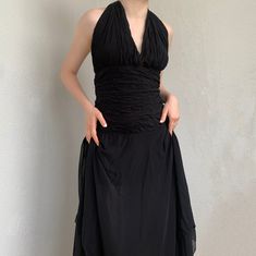 Stunning black evening crinkled chiffon dress in maxi length. Features a beautiful floating silhouette, an asymmetrical layered skirt, a fitted bodice and a halter top with a V-neckline and ties. Embellished on the bodice with black beads, also has a zipper fastening in the back. Such a beautiful piece!  SIZE  - Size on the label 6, approximately L now - See measurements :) CONDITION  - Great condition, pretty much no signs of wear, but some beads might be missing BRAND - Yves Calin  MEASUREMENT Flowy Chiffon Evening Dress, Fitted Long Chiffon Evening Dress, Maxi Length Evening Dress With Folds, Ruched Chiffon Evening Dress, Chiffon Evening Dress With Ruched Details, Chiffon Maxi Dress With Ruched Bodice For Cocktail, Fitted Chiffon Maxi Evening Dress, Fitted Long Dress With Ruched Detail, Fitted Dresses With Ruched Long Skirt