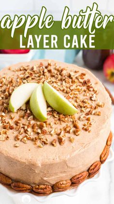 a cake topped with apples and pecans on top of a white plate