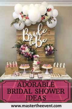 a table topped with cake and balloons next to a wooden sign that says bridal