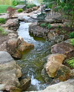 a small stream running between two large rocks