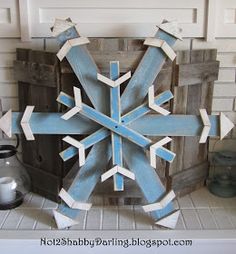 a wooden snowflake sitting on top of a counter