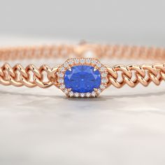 Unveil your style with our 10K Solid Gold Cuban Chain Link Bracelet, adorned with captivating Natural Blue Sapphires and meticulously crafted Lab Grown Diamonds. Personalize this bracelet with your choice of design, making it a one-of-a-kind treasure. 𝐅𝐞𝐚𝐭𝐮𝐫𝐞𝐬:• 𝐌𝐚𝐝𝐞 𝐭𝐨 𝐎𝐫𝐝𝐞𝐫• 𝐌𝐞𝐭𝐚𝐥: 𝟏𝟎𝐊 𝐆𝐨𝐥𝐝 | 𝟏𝟒𝐊 𝐆𝐨𝐥𝐝 | 𝟏𝟖𝐊 𝐆𝐨𝐥𝐝• 𝐁𝐚𝐧𝐝 𝐂𝐨𝐥𝐨𝐫𝐬: Rose Gold, Yellow Gold & White Gold• 𝐁𝐫𝐚𝐜𝐞𝐥𝐞𝐭 𝐖𝐢𝐝𝐭𝐡: 8.60 MM• 𝐁𝐫𝐚𝐜𝐞𝐥𝐞𝐭 𝐓𝐡𝐢𝐜𝐤𝐧𝐞𝐬𝐬: 5.4 Luxury Blue Gold Bracelet For Formal Occasions, Elegant Blue Chain Bracelet As Gift, Elegant Blue Chain Bracelet For Gift, Luxury Blue Gold Jubilee Bracelet, Elegant Blue Gold Bracelet For Formal Occasions, Elegant Blue Bangle Gold Bracelet, Elegant Blue Jubilee Gold Bracelet, Blue Gold Bracelet For Gift, Fine Jewelry, Fine Jewelry Blue Gold Bracelet For Gift