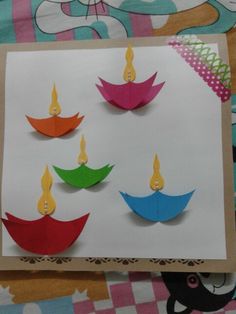 the paper is cut out to look like candles for diwaling origami