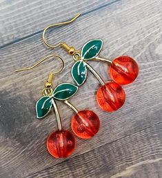 Beautiful handmade cherry glass dangle earring charms are the perfect accessory for your summer outfit! Grab your unique jewelry treasures today before this rare item is gone! Thank you so much for supporting my shop and helping us be able to create more beautiful unique jewelry treasures!  WHAT YOU GET: Handmade cherry glass charm dangle earrings will come packaged with care in a gifted jewelry box, where you can either keep your jewelry inside to store when you're not wearing it, or the gift b Summer Gift Cherry Earrings, Retro Red Summer Jewelry, Cherry Dangle Earrings With Ear Wire, Vintage Jewelry As Summer Gift, Vintage Jewelry For Summer Gifts, Vintage Summer Jewelry Gift, Vintage Red Resin Jewelry, Nickel-free Cherry Colored Earrings For Gift, Nickel Free Cherry Colored Earrings For Gift