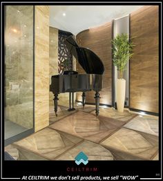 a grand piano sitting in the middle of a room next to a glass wall and door