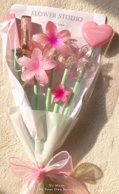 a bouquet of pink flowers in a wrapper