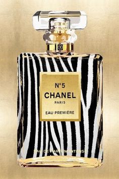 a bottle of chanel no 5 eau premiree on a gold background