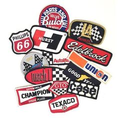 various patches and stickers are arranged in the shape of a pile on top of each other