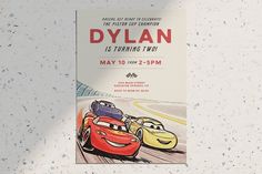 a birthday card with two cartoon cars on the front and one in the back that says, dylan is turning two