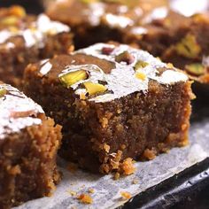 several pieces of cake sitting on top of a pan