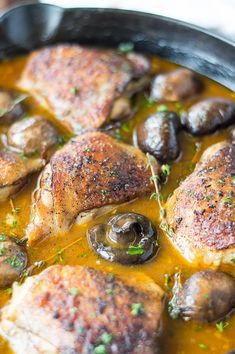 chicken with mushrooms and sauce in a skillet