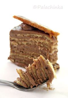 a piece of cake with chocolate frosting on a fork