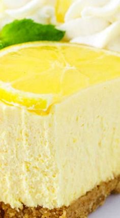 a slice of lemon cheesecake with whipped cream on top