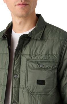 This quilted shirt jacket with rugged twill on the reverse gives you two outerwear options as the temps begin to drop. 30" length Front snap closure Snap cuffs Front welt pockets; chest snap-flap patch pocket Lined, with 100% polyester fill 100% polyester Machine wash, tumble dry Made in China Rugged Button-up Outerwear With Patch Pockets, Urban Button-up Outdoor Outerwear, Urban Quilted Jacket With Pockets For Fall, Rugged Long Sleeve Outerwear With Padded Collar, Casual Quilted Jacket With Patch Pockets And Long Sleeves, Casual Outdoor Utility Jacket With Padded Collar, Casual Utility Jacket With Padded Collar For Outdoor, Casual Button-up Quilted Jacket With Pockets, Casual Quilted Utility Jacket With Long Sleeves