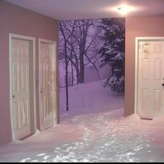 an empty room with snow on the floor and two doors leading to another room in the background