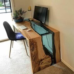 a desk with a computer on top of it