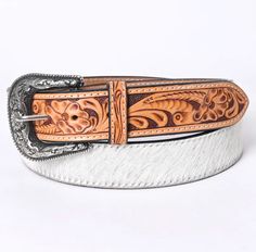 Meticulously hand-tooled, carved, and meticulously antiqued by skilled artisans, this belt showcases exceptional craftsmanship. Crafted from the finest Vegetable Tanned American Genuine Cowhide Leather, it embodies quality, style, and heritage. Expertly hand crafted from premium hand-tooled vegetable-tanned genuine cowhide leather. The belt is furnished with a removable high-quality matching hand-tooled leather-covered buckle, showcasing exceptional craftsmanship and attention to detail. Elevate Womens Belts, Mens Tools, Toddler Boots, Long Sleeve Kids, Boys Bottoms, Hand Tooled Leather, Boys Pajamas, Genuine Leather Belt, Tooled Leather