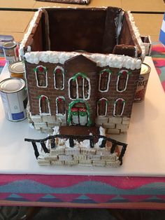 a gingerbread house made to look like it is being built