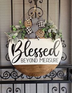 a wooden sign that says,'blessed beyond measure'on the side of a gate