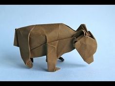 an origami bear made out of brown paper