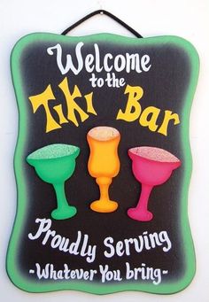 a sign that says, welcome to the tiki bar proudly serving whatever you bring