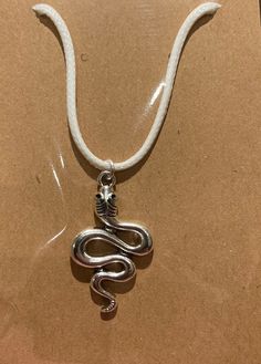 "A silver nearly 1 1/2\" snake pendant on an adjustable 18\" wax cord necklace" Adjustable Metal Snake Shape Necklace, Adjustable Metal Snake Shape Necklaces, Metal Snake Shape Necklace, Snake Shape Necklace With Adjustable Chain, Silver Casual Necklace With Adjustable Length, Casual Silver Necklace With Adjustable Length, Girl Hunting, Wax Cord Necklace, Hunting Jewelry