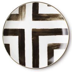 a black and white plate with an artistic design on the front, featuring cross marks