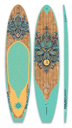 a wooden surfboard with an intricate design on the front and back sides, along with two paddles