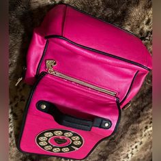 Gorgeous Betsey Johnson Telephone Pocketbook With Attached Adjustable Strap, 2 Inside Pockets & Zipper Compartment. Brand New***Without Tags! Approx. L” Is 8” Across, H Is 9”(Not Counting Straps), 4.5 Diameter Inside. From Nonsmoking Home. ***Backside Has Some Pink Trim Coming Undone Above The Outside Zipper. Unique Pocketbook From Betsey Johnson Is Vintage-No Tags-Never Used! Pink Mobile Phone Shoulder Bag For Errands, Pink Shoulder Bag For Errands, Chic Pink Mobile Phone Bag, Pink Mobile Phone Bag For Travel, Pink Backpack With Mobile Phone Pocket, Pink Backpack With Phone Pocket, Pink Backpack With Mobile Phone Bag, Pink Mobile Phone Shoulder Bag For School, Pink Phone Bag With Removable Pouch For Travel