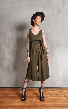 The perfect summer boho jumpsuit is here! Wide-leg pants, dripping around your figure like a waterfall and a looser style that will allow you to go anywhere in this beauty and feel comfortable. Its unique backless design will give you a chic and edgy look and you can adjust the fit at the waist with the subtle belt. It's a must-have for the new season! Be Love ♥♥ ♥ Material: Jarsey 90% viscose, 10% elastane ♥ Care Hand Wash / Dry Cleaning Machine 30oC / 104oF Max Do Not Tumble Dry Do Not Bleach Bohemian Sleeveless Party Jumpsuit, Bohemian Sleeveless Jumpsuits For Party, Bohemian Sleeveless Party Jumpsuits And Rompers, Bohemian Sleeveless Jumpsuits And Rompers For Party, Summer Festival Stretch Jumpsuits And Rompers, Bohemian Jumpsuits And Rompers For Spring Party, Sleeveless Jumpsuits And Rompers For Festivals, Summer Sleeveless Party Jumpsuit, Summer Sleeveless Party Jumpsuit Or Romper